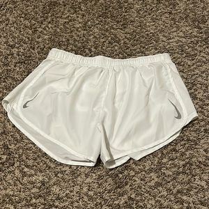 white nike shorts with grey checks on both sides.